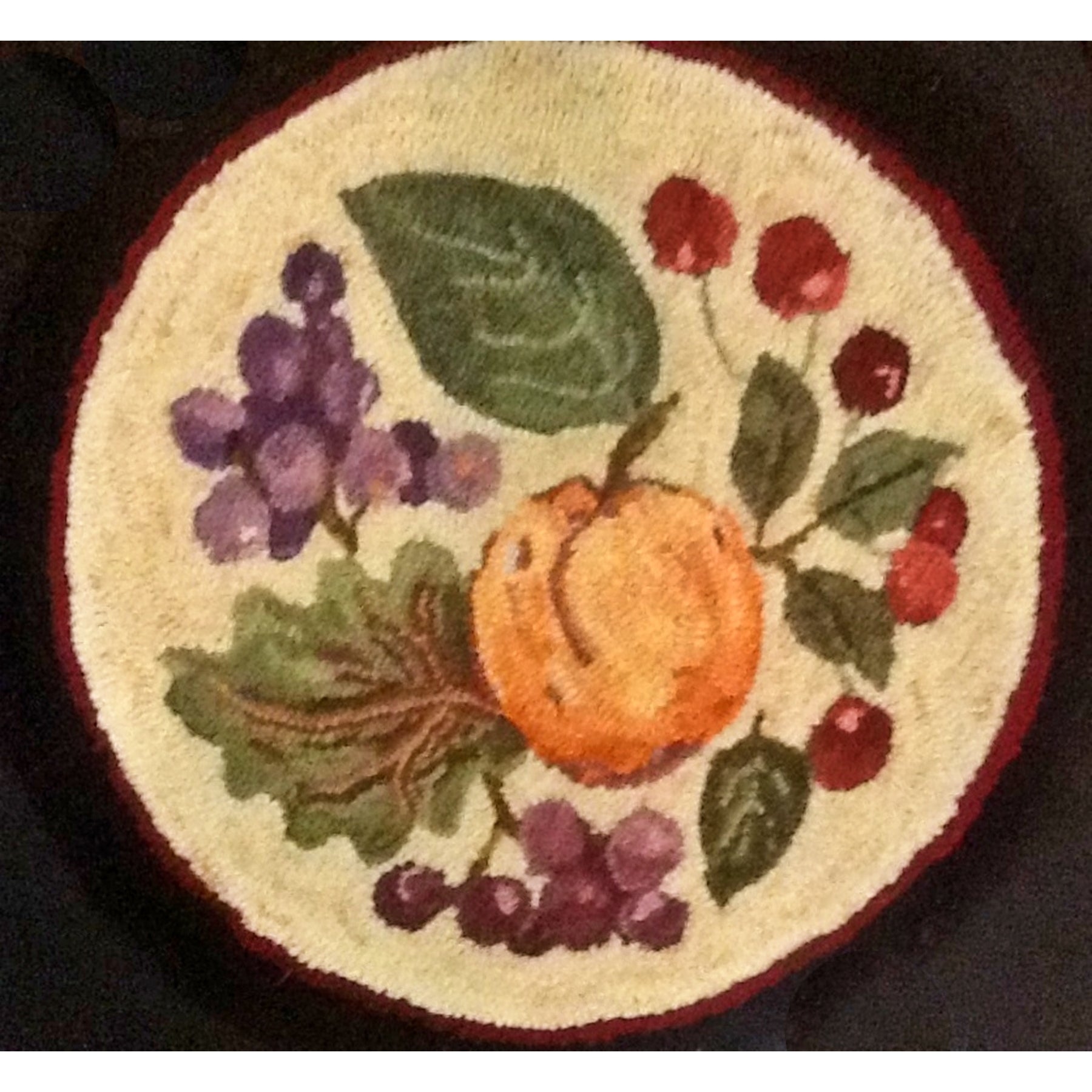 Peach, Grapes, Cherry, rug hooked by Margaret Cowell