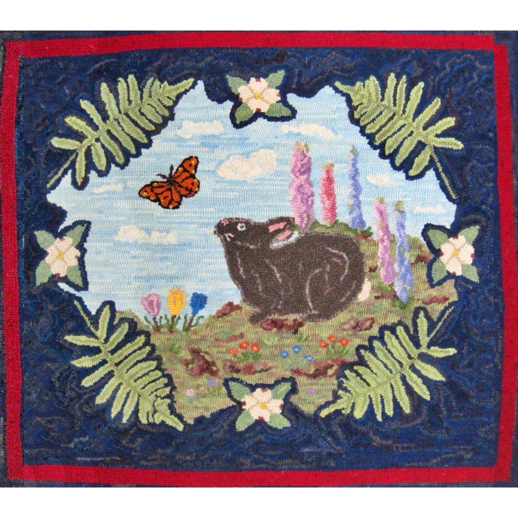 Nosy Rabbit Center, rug hooked by John Leonard