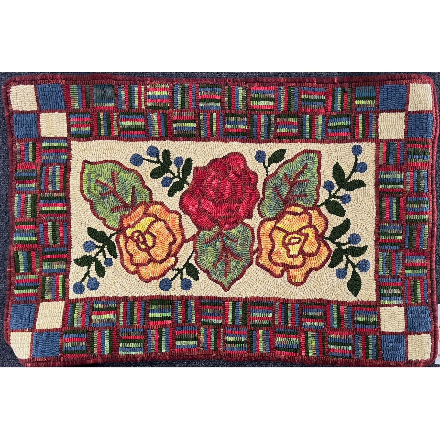 Three Rose Antique, rug hooked by Suzanne Chaddock