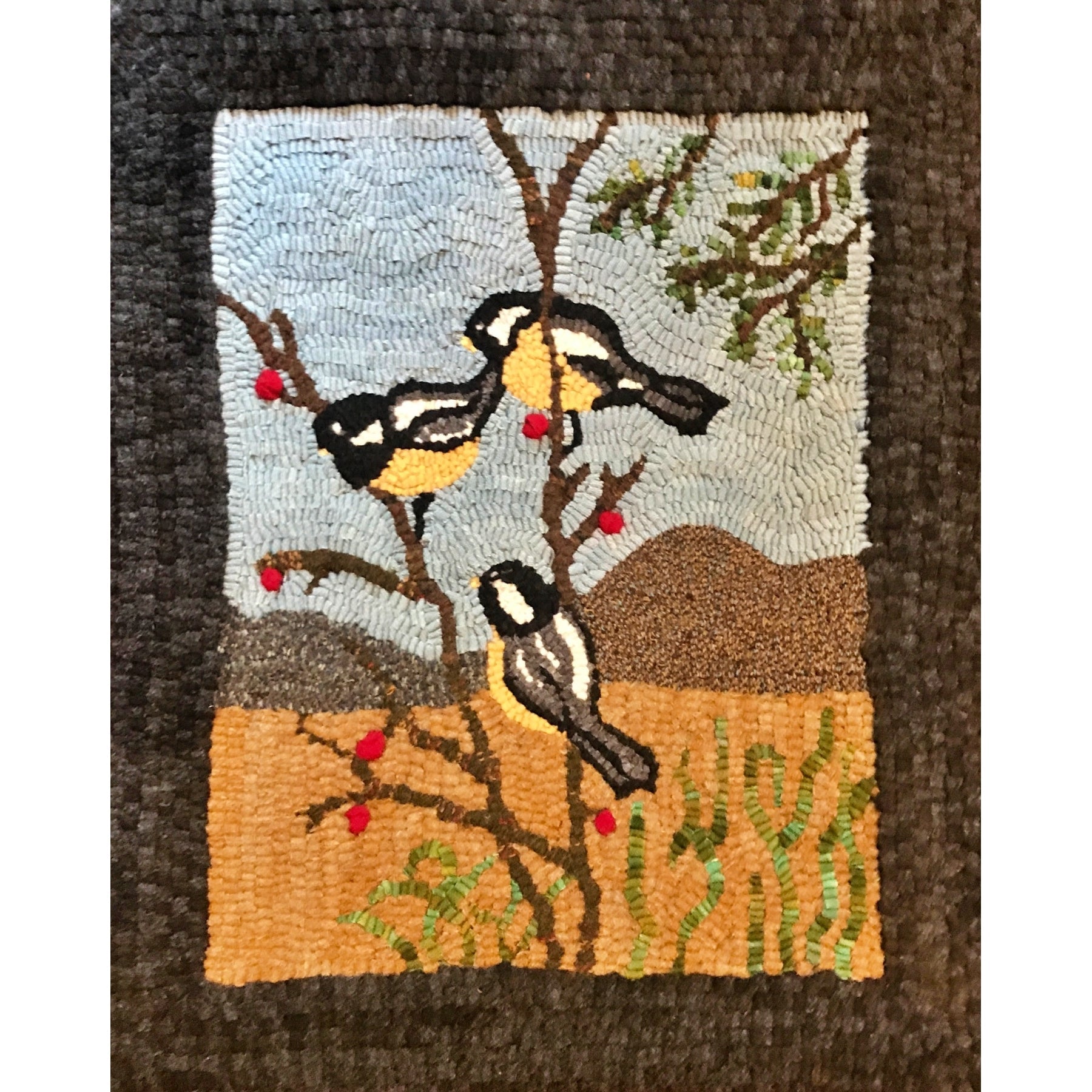 Chickadees, rug hooked by Mya Zschokke