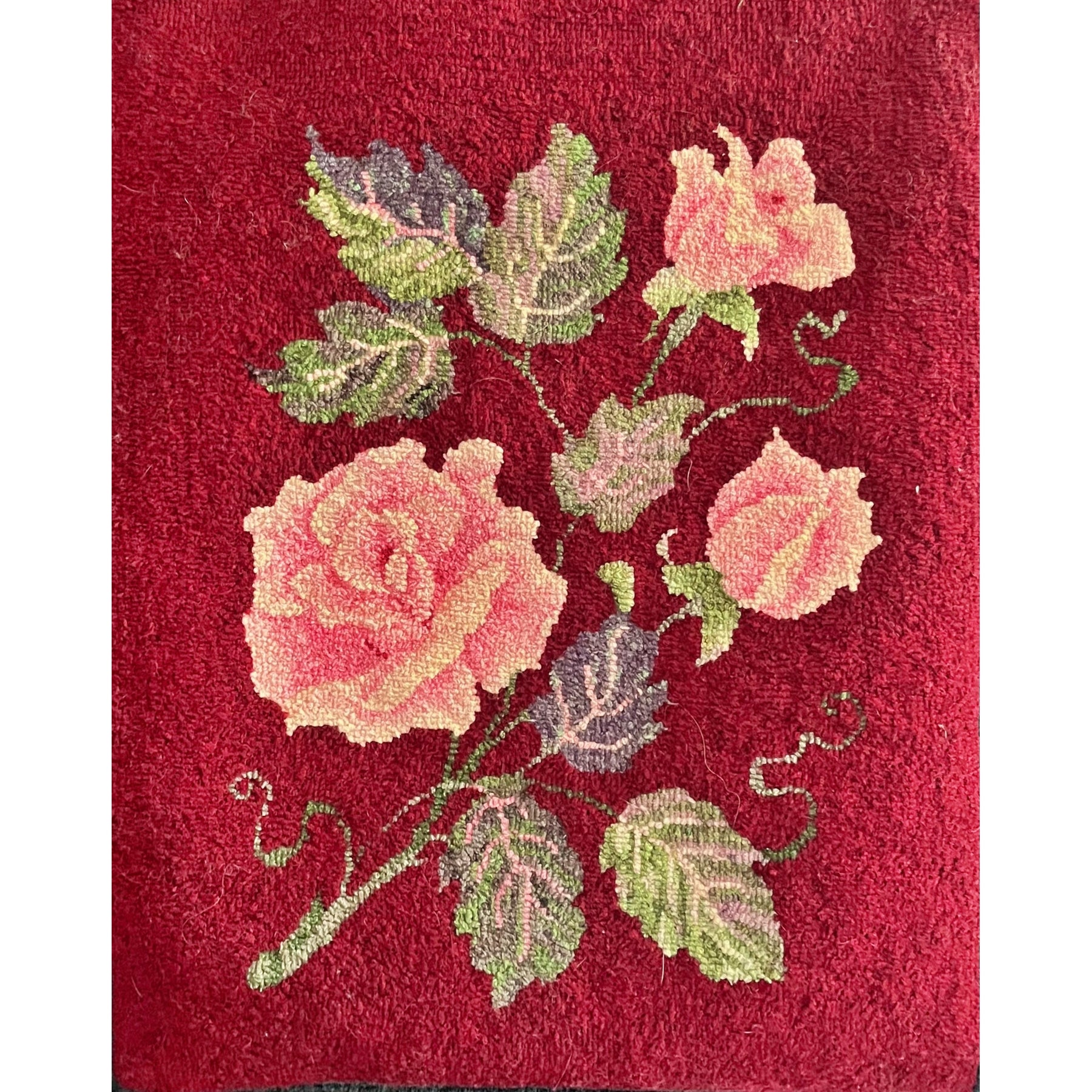 Roses, rug hooked by Dawn Hebert