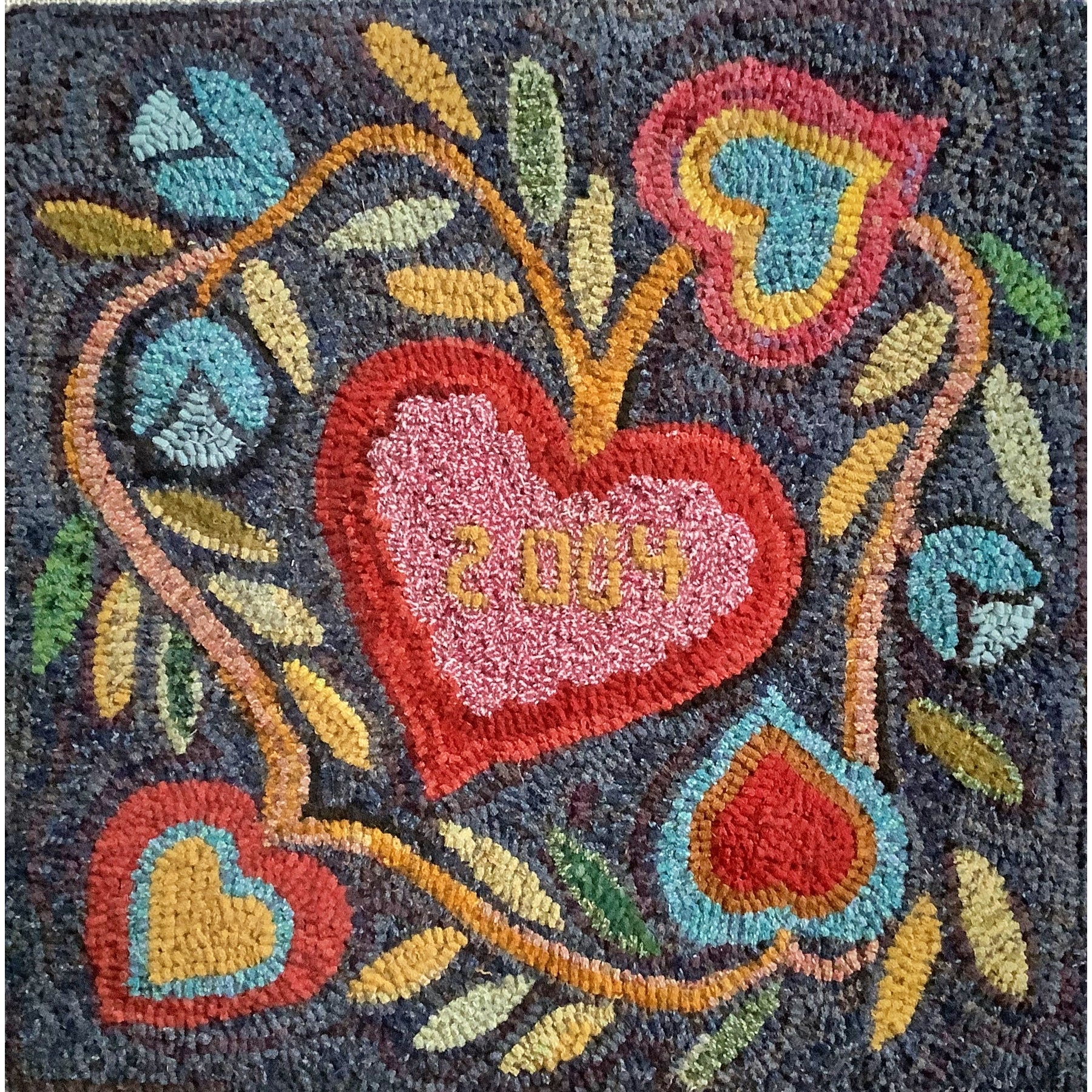 Hearts And Tulips, rug hooked by Kathleen Lynch