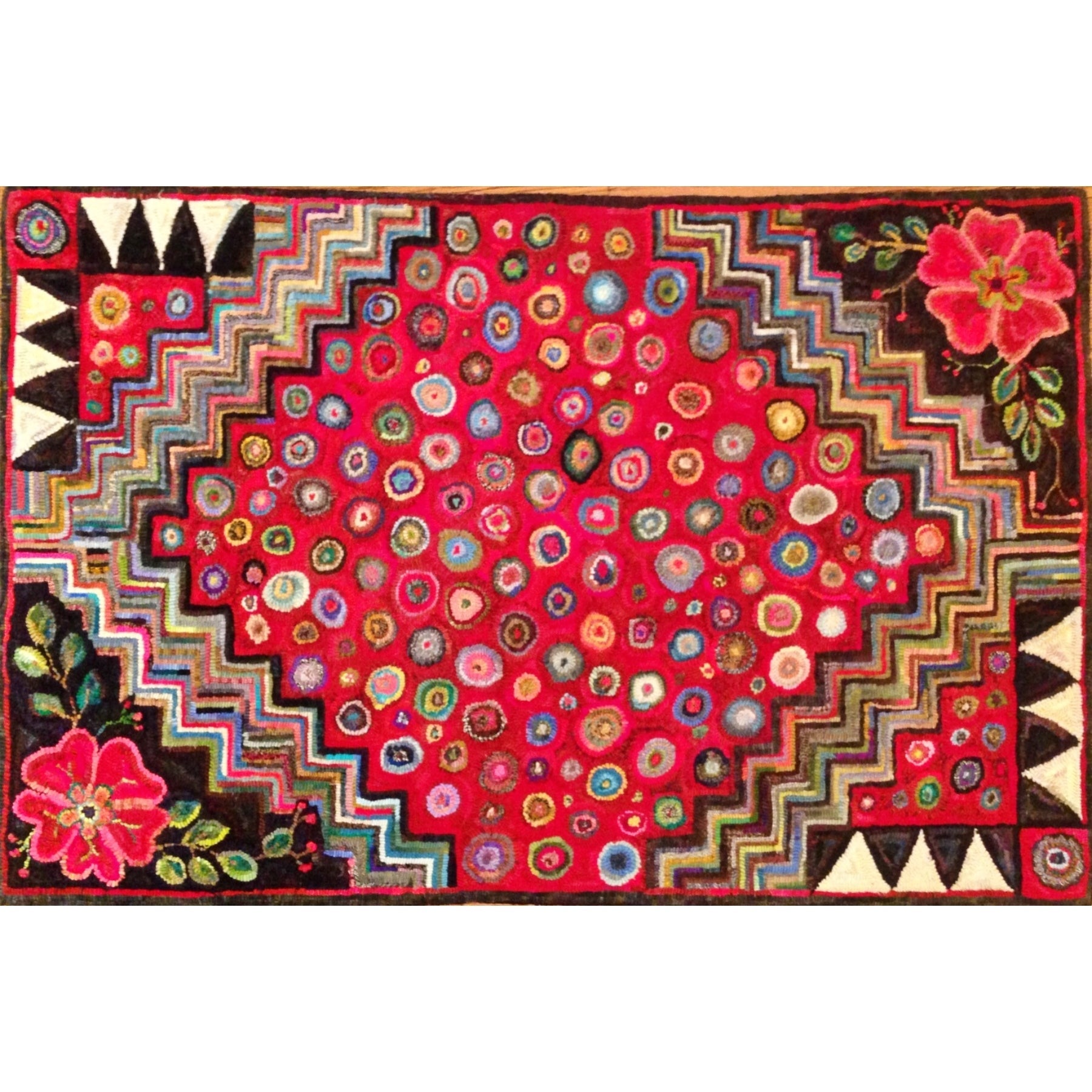 Cat Paw Floral Geometric, rug hooked by Gina Paschal