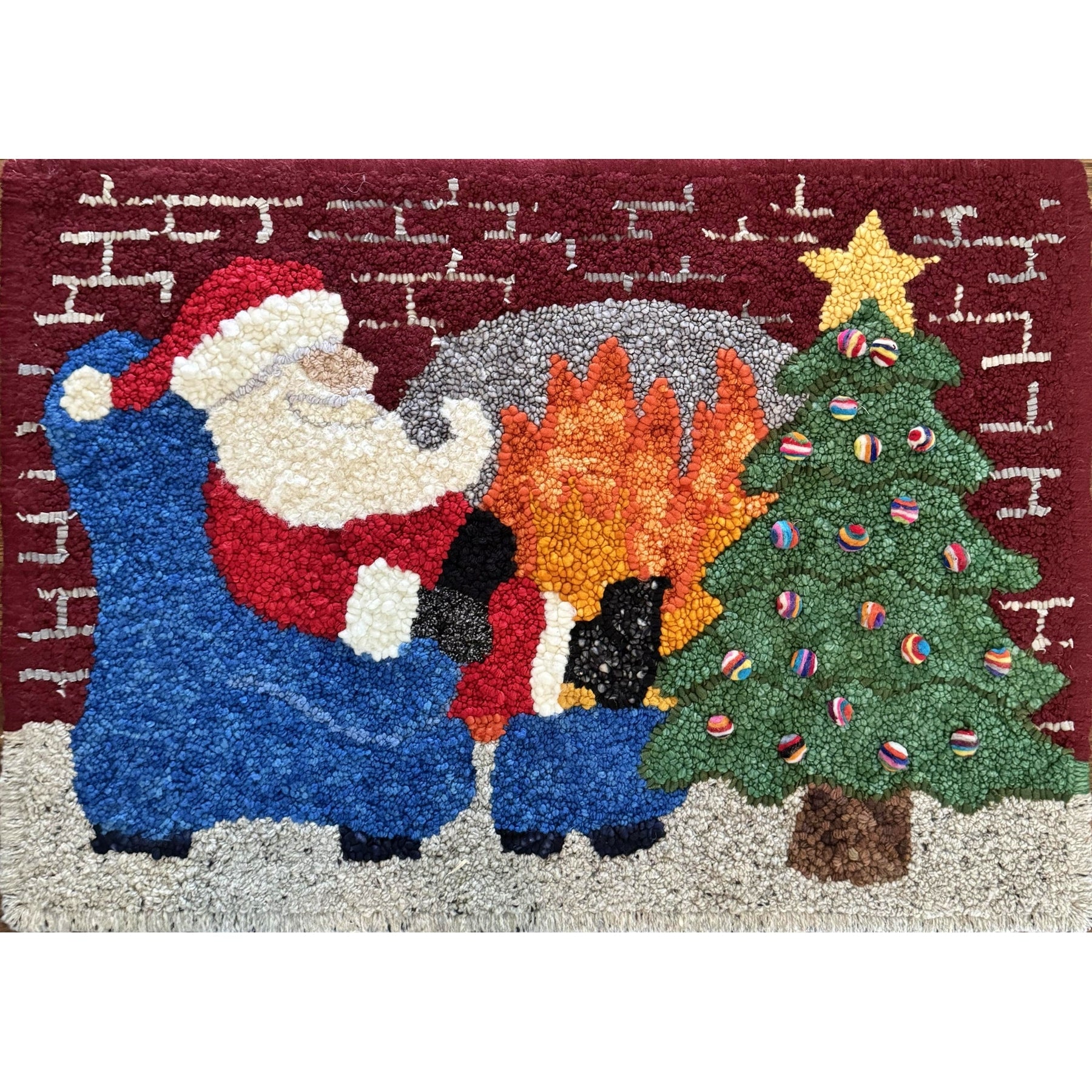 Santa by the Fire, rug hooked by Deena Schaffer