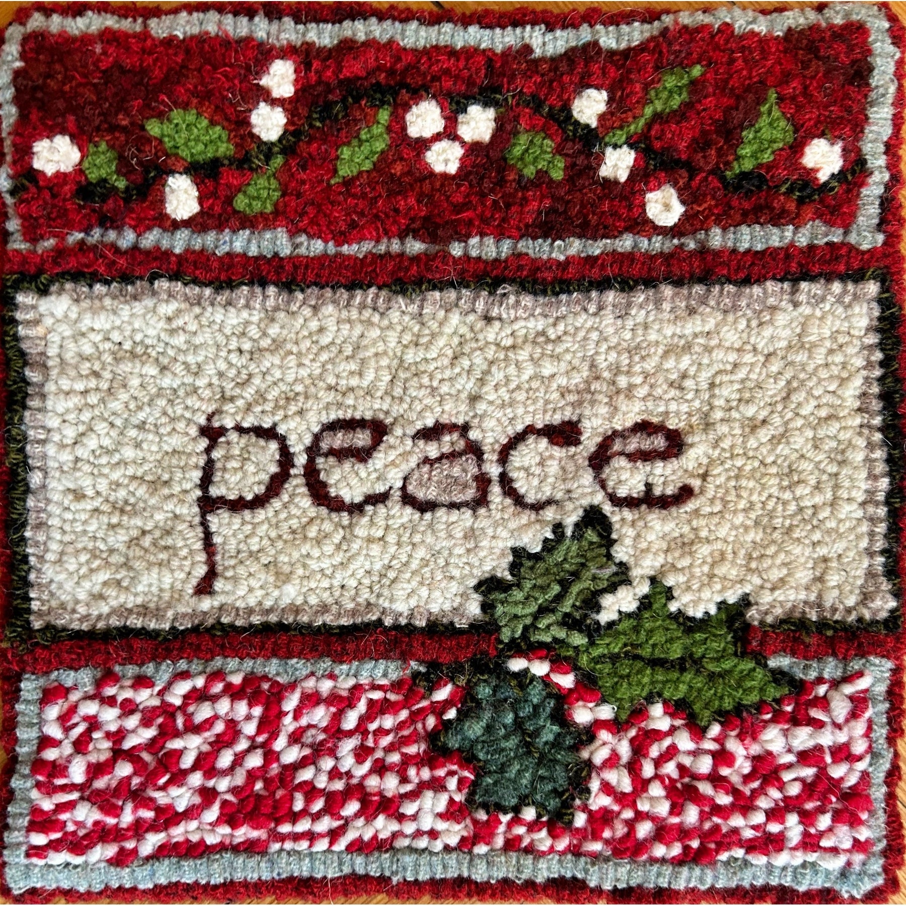 Peace Holiday Mat, rug hooked by Mary O'Donnell