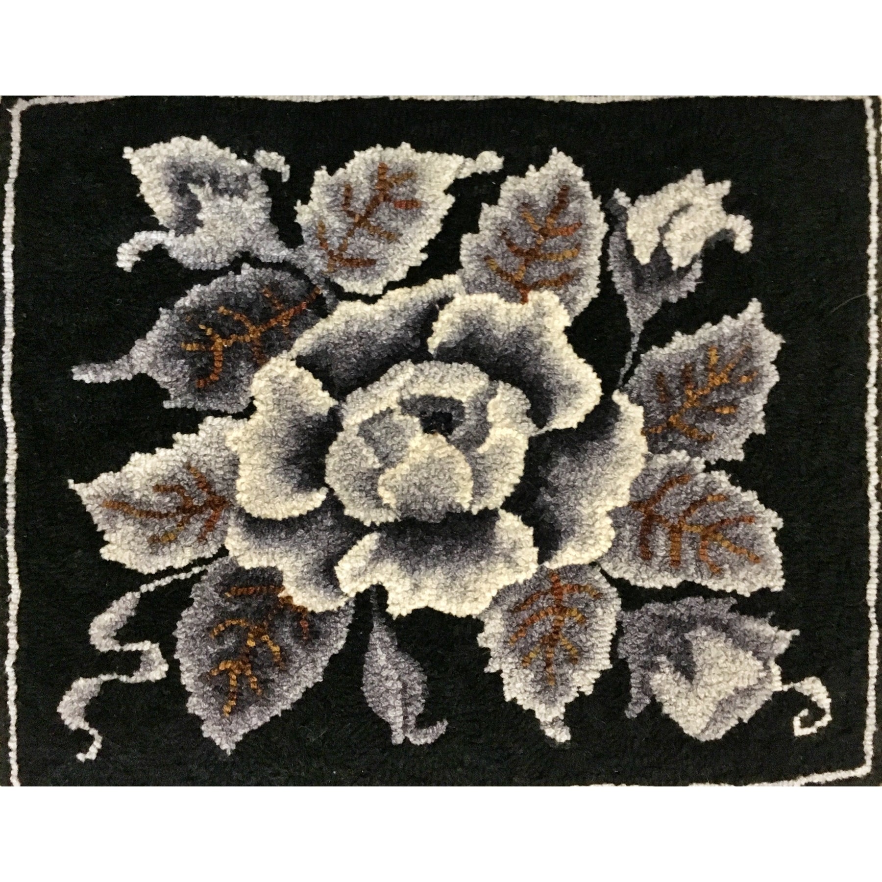 Rose, rug hooked by Benita Raleigh